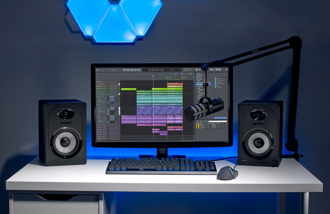 MediaOne M50BT on desk with computer and broadcast microphone