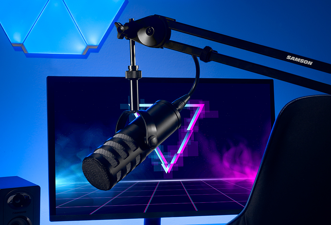 Q9x on boom stand in front of computer